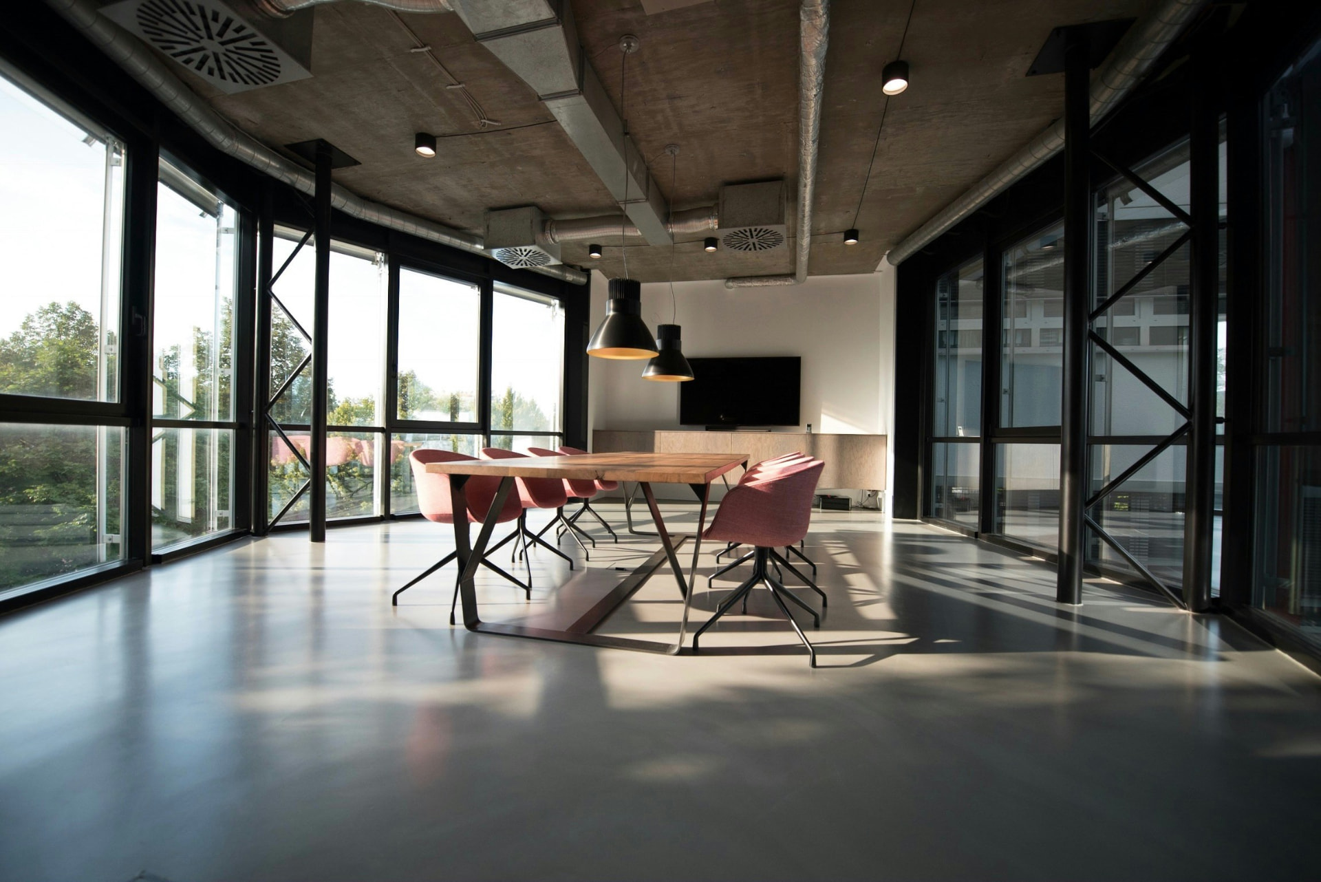 Sunlit meeting room with a boardroom table